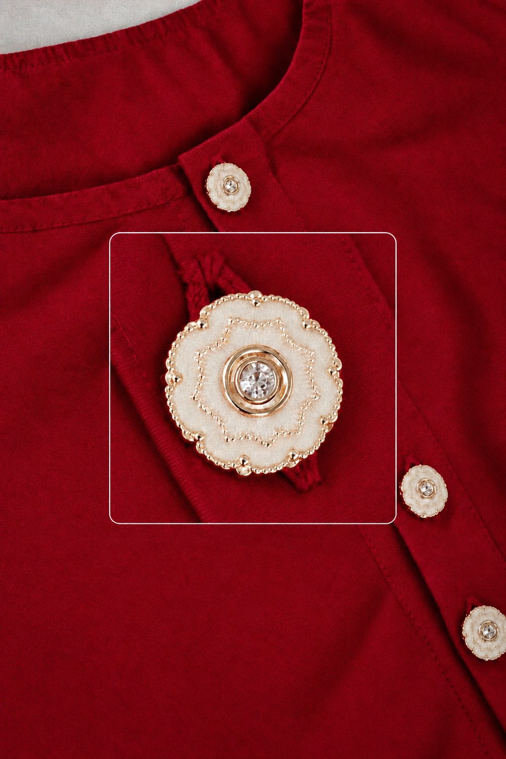 Close-up of the decorative buttons on the Noor red cotton dress